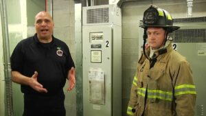 Mike Dragonetti and firefighter with elevator power