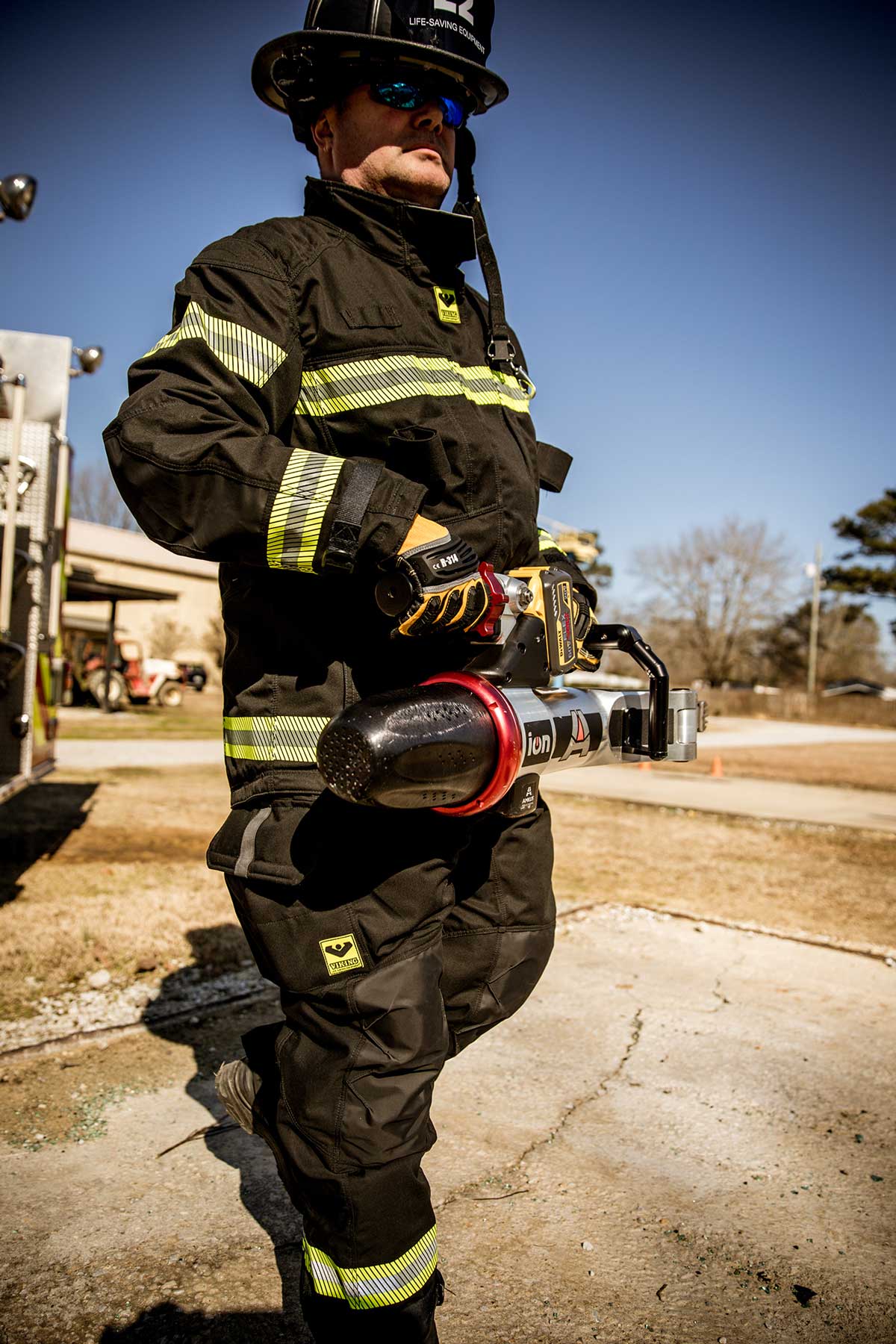 Firefighter in Viking PPE with extrication tool