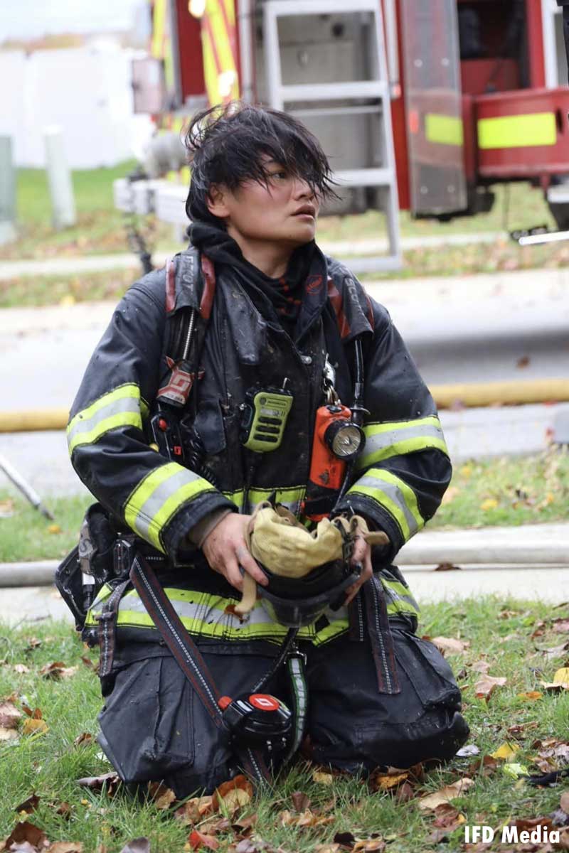 Indianapolis firefighter removes mask on scene