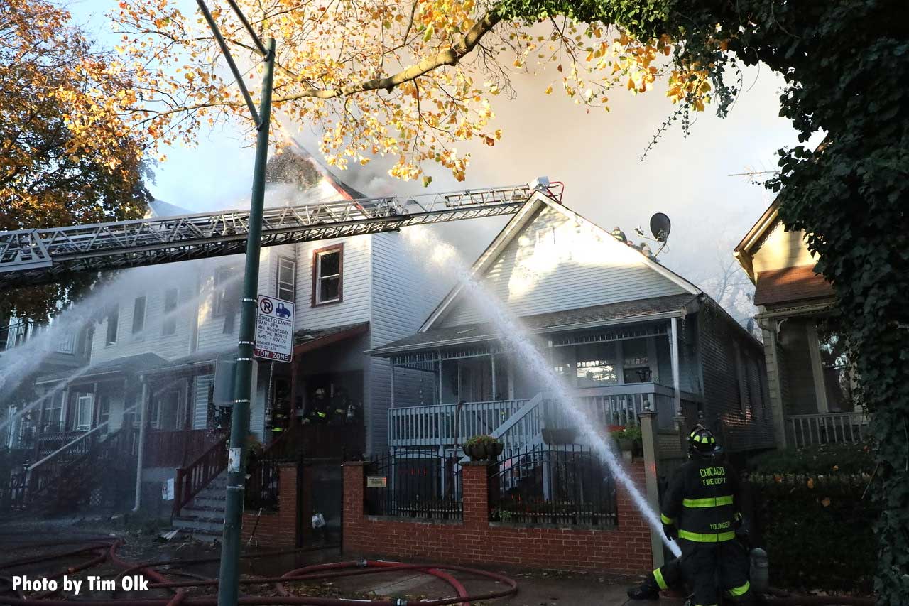 Aerial ladder and Chicago firefighters on line