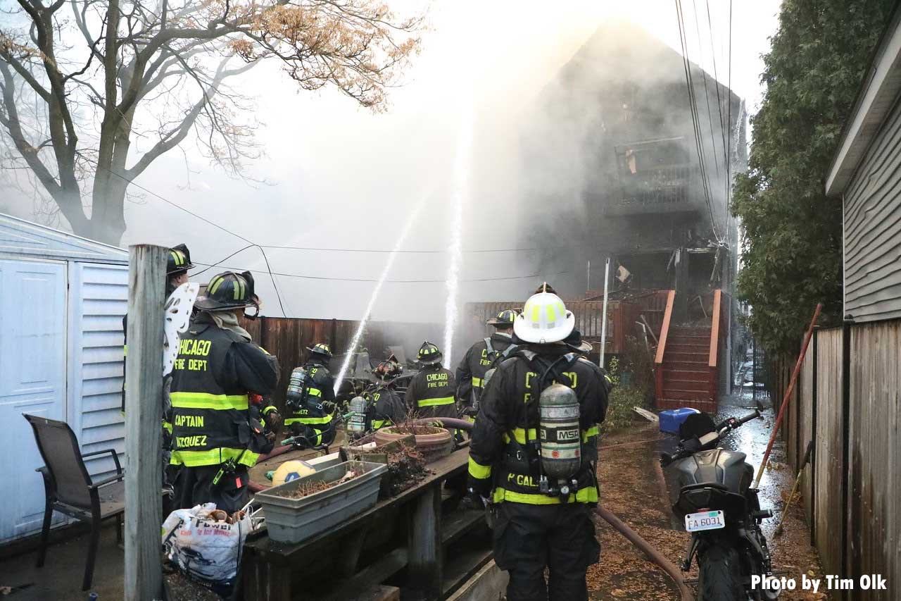 Chicago firefighters put exterior streams on home