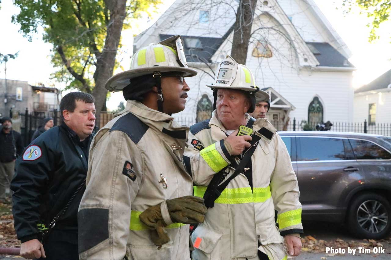 Chicago fire chief officers talk at fire scene