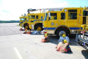 PPE in front of fire trucks