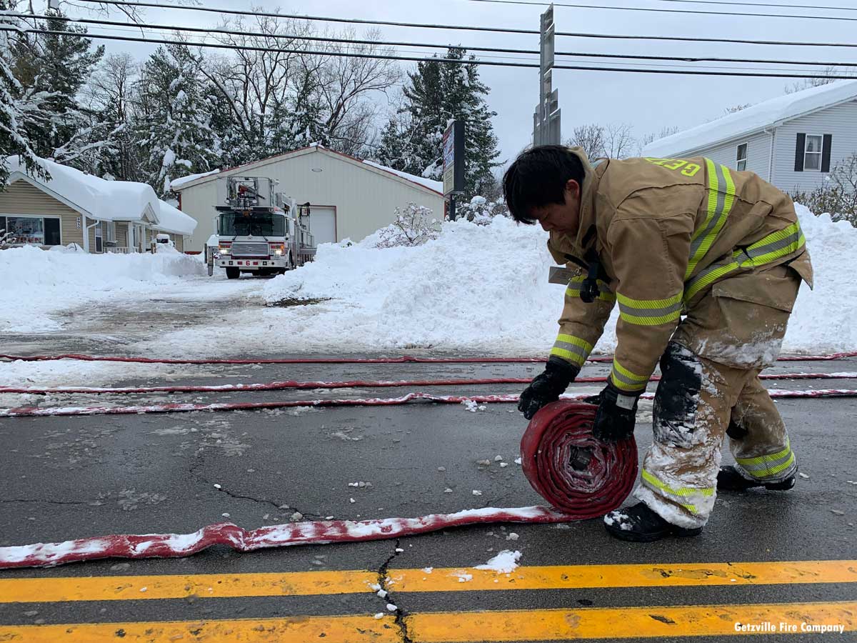 8. Getzville firefighter Tim Le helping clean up after a structure collapse fire in Orchard Park