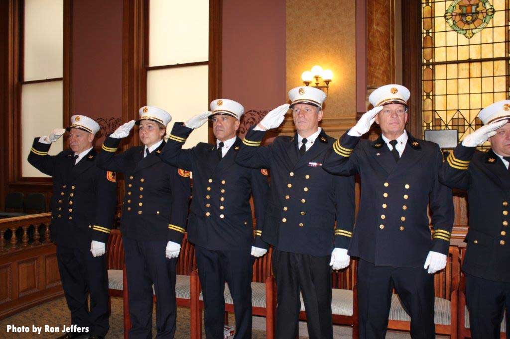 Constance Zappella and other Jersey City fire chiefs salute