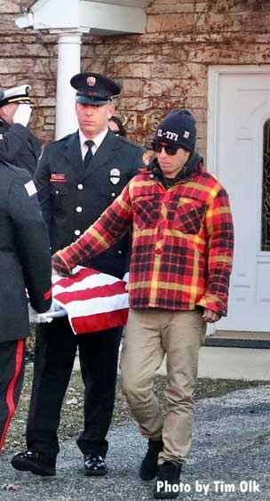 Firefighter and fallen firehouse dog