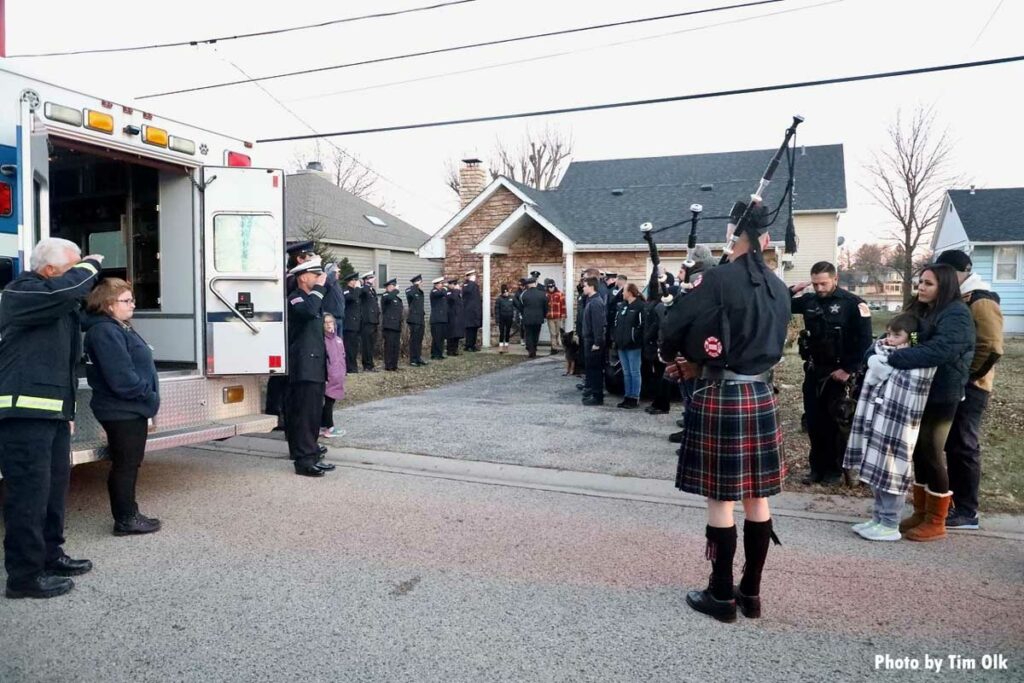 Piper plays during memorial for firehouse dog