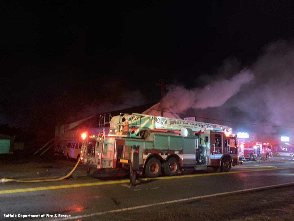 Smoke vents from upper window of structure in Suffolk, Virginia