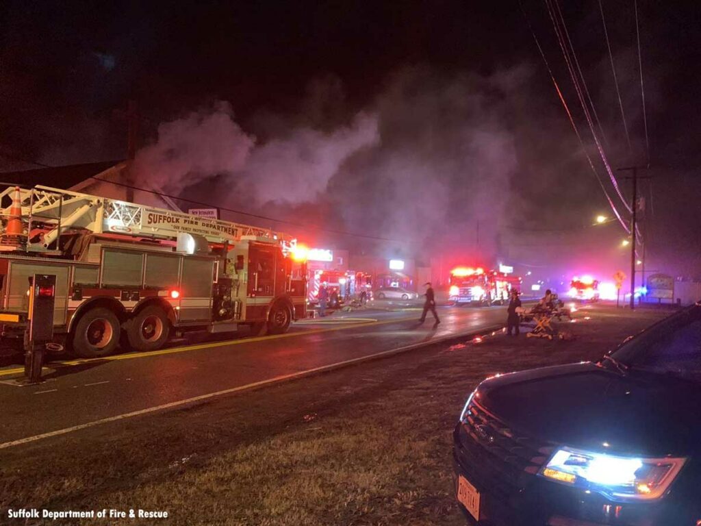 Suffolk firefighters and fire trucks at church fire