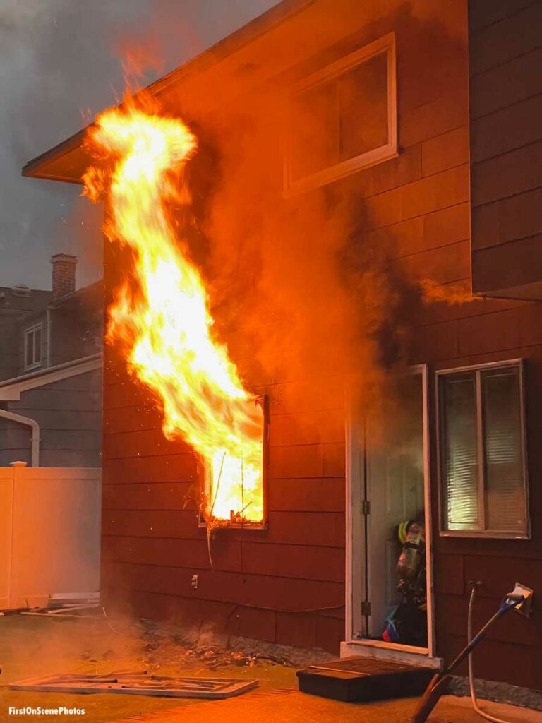 Firefighter makes entry to raging Hempstead New York house fire