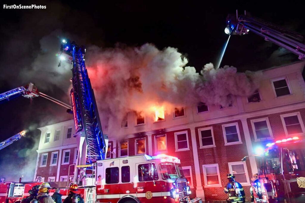 Tower ladders flowing water at Roslyn office building fire