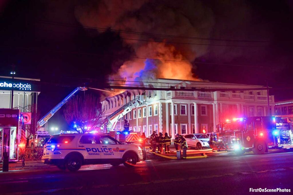 Elevated master streams and fire trucks at Roslyn office building fire