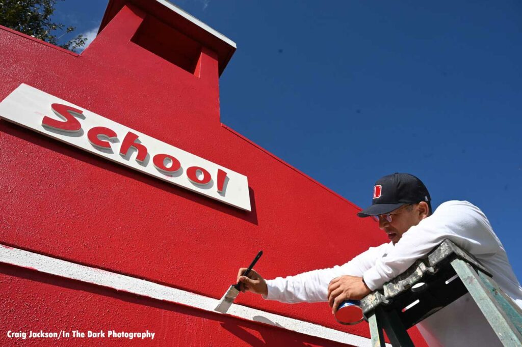 Orlando firefighter paints schoolhouse building at Children’s Safety Village