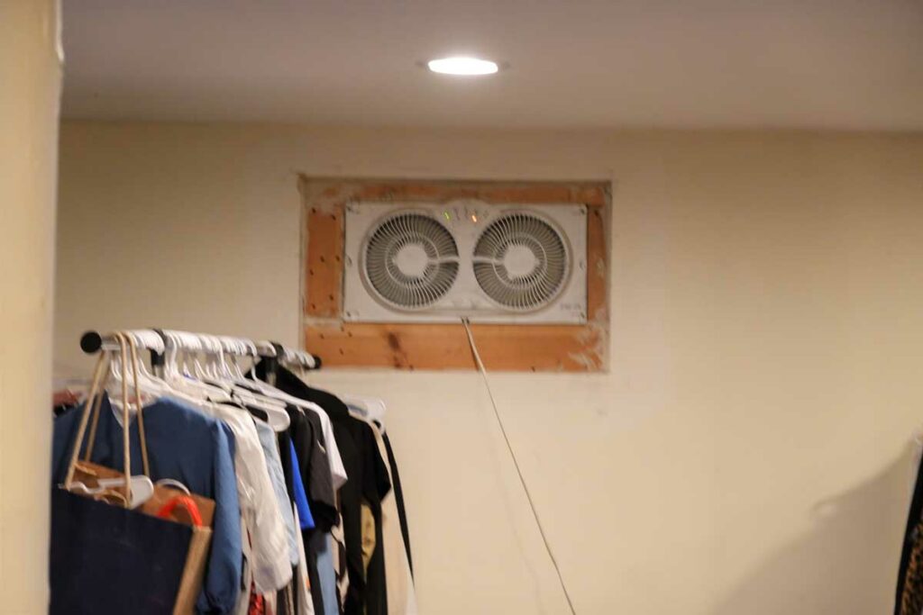 Fan in window of home's basement