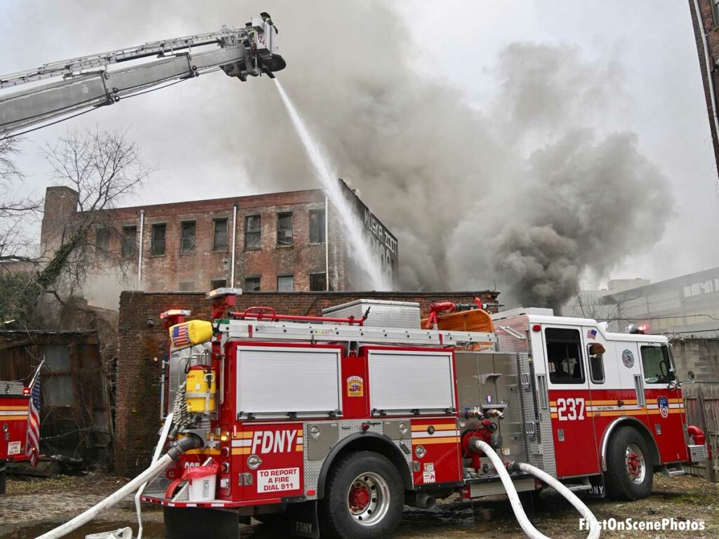 FDNY fire engine and Tower ladder flowing water at Brooklyn fire