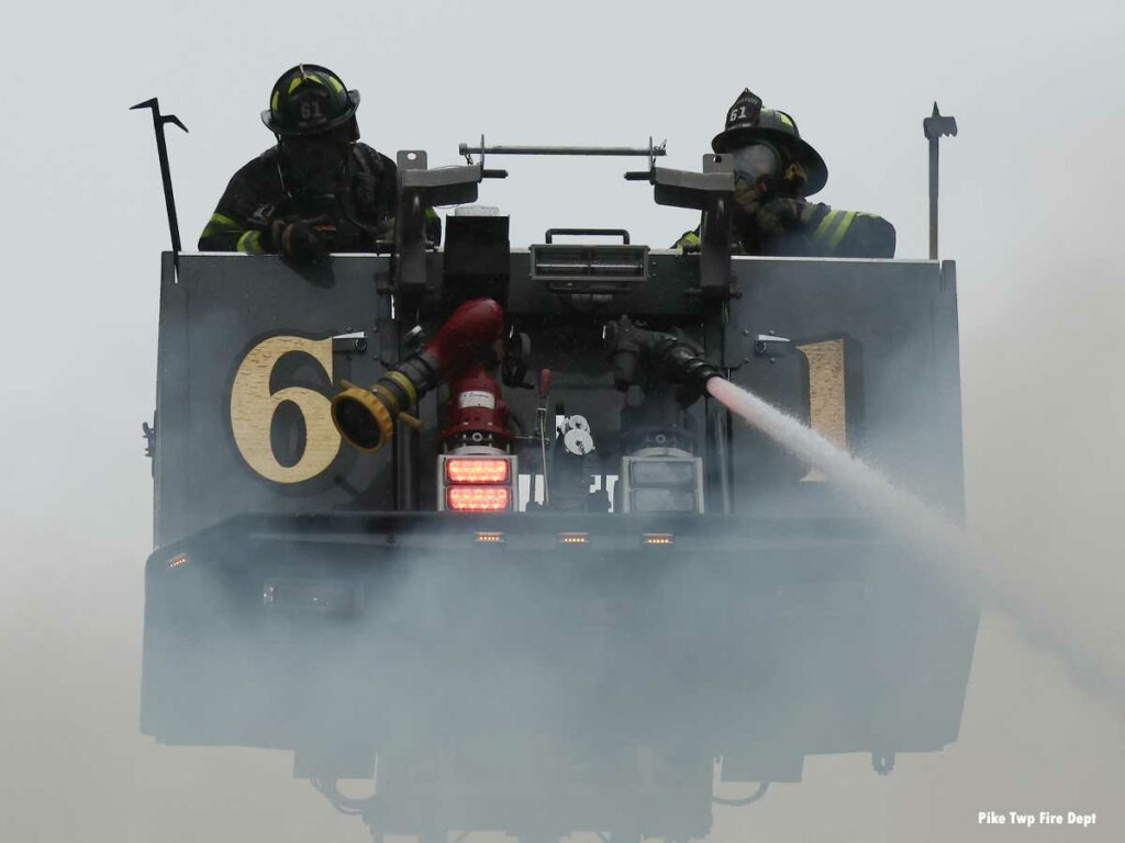 Pike Township Indiana firefighters in a twoer ladder bucket responding to March 2023 fire