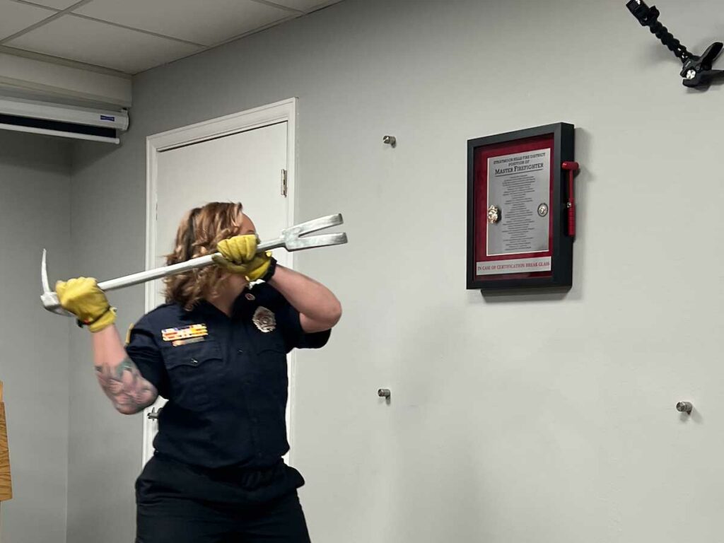 Female firefighter with halligan