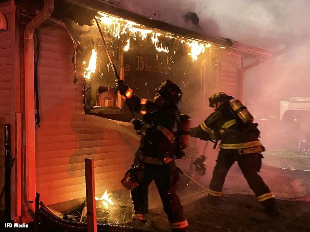 Firefighters pull building exterior during Indianapolis fire