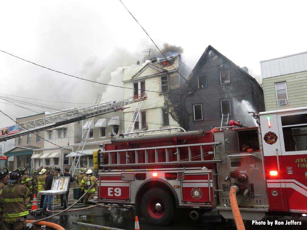 Firefighters with Jersey City aerial at fire