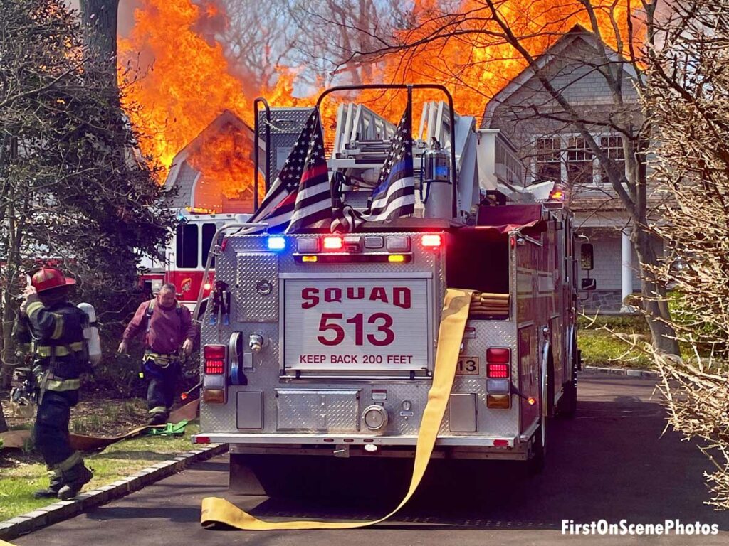 Squad 313 arriving at fire in large home