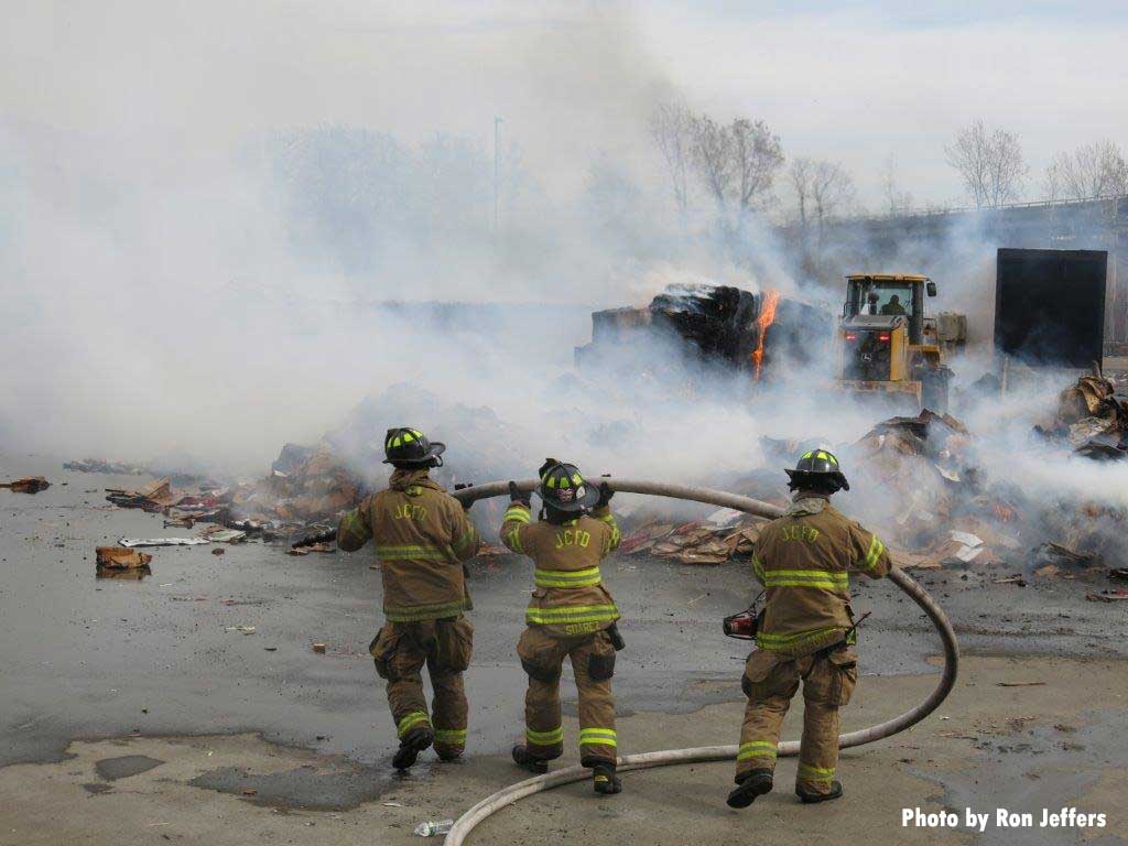 Jersey City firefighters work hoseline at massive fire