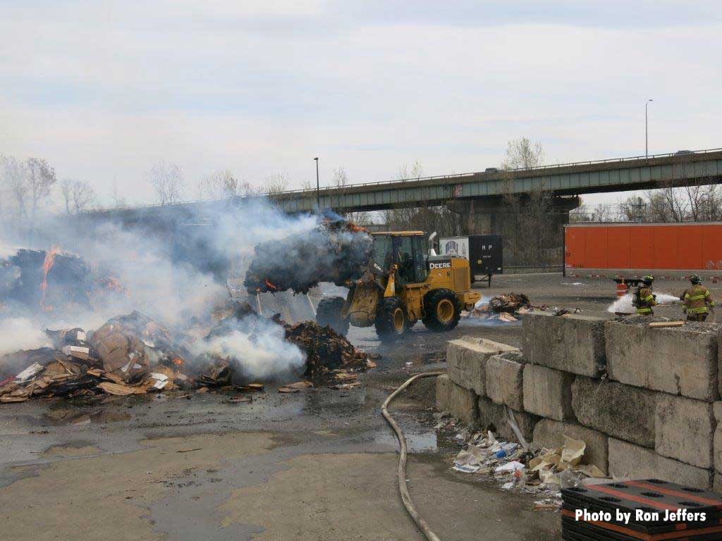 Front end loader moving debris at Jersey City fire