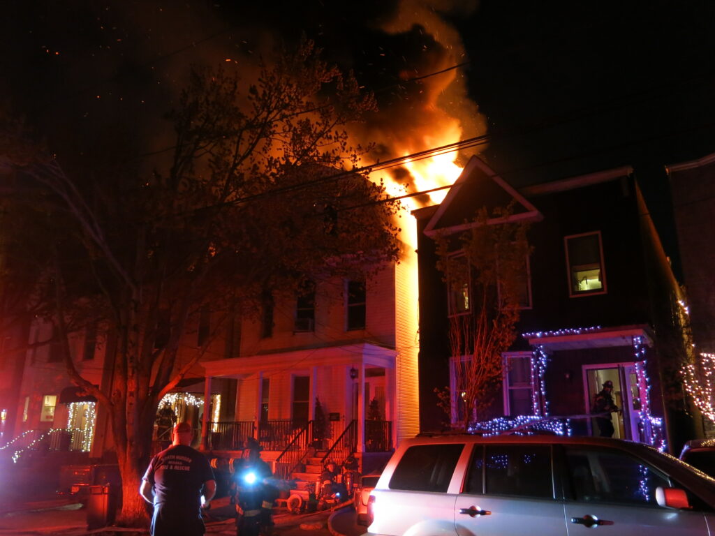 Flames and smoke surge above buildings during fire in Weehawken, New Jersey