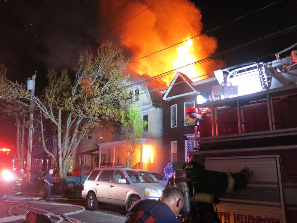 Flames shoot over buildings during Weehawken fire