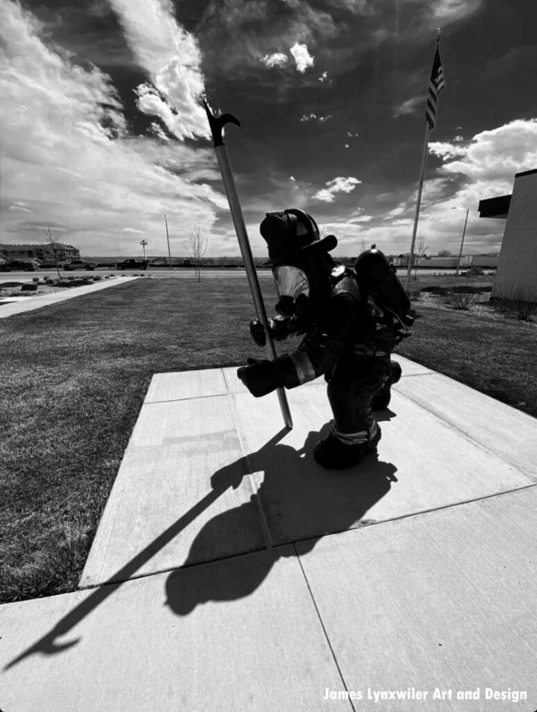 Black and white firefighter statue