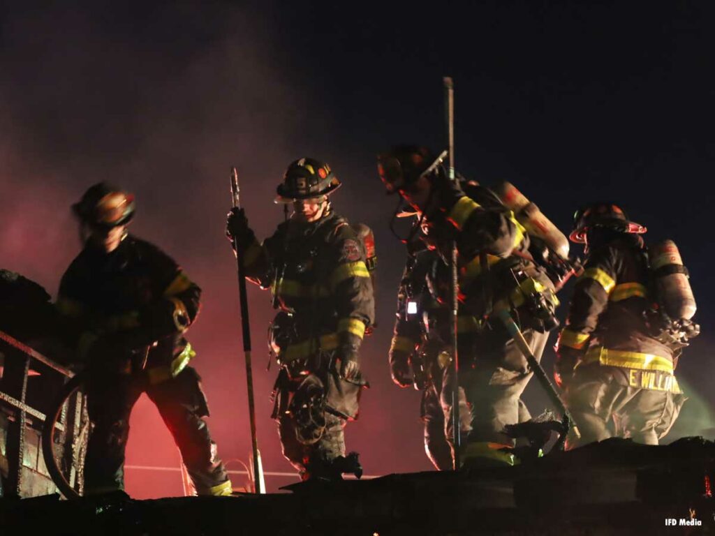 Indianapolis firefighters on a roof