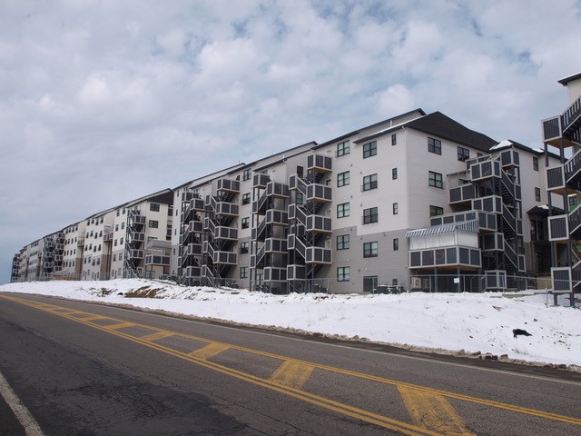 Five-story open web floor trusses with exterior balcony exits