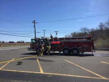 Firefighter hoseline deployment from fire truck