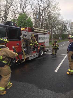 Firefighter training hose deployment drills