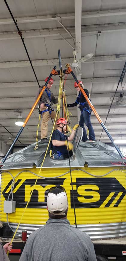 Firefighters make access to grain bin