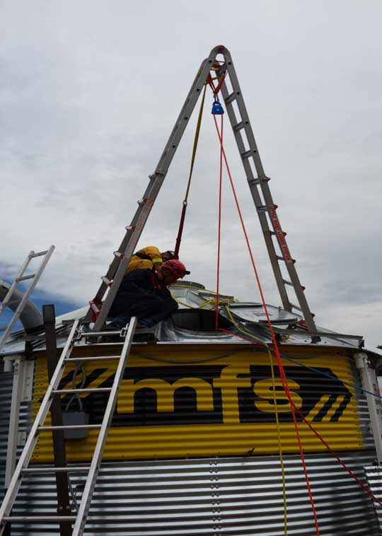 Multipurpose folding ladder being used for a high point.