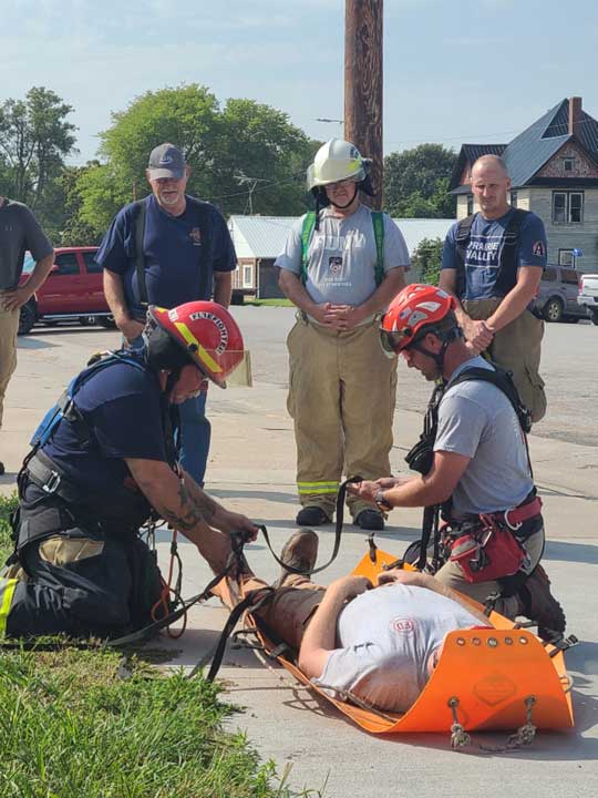 Rescuers train on patient packaging for grain bin rescue