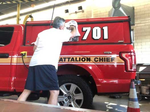 Fire chief cleaning vehicle