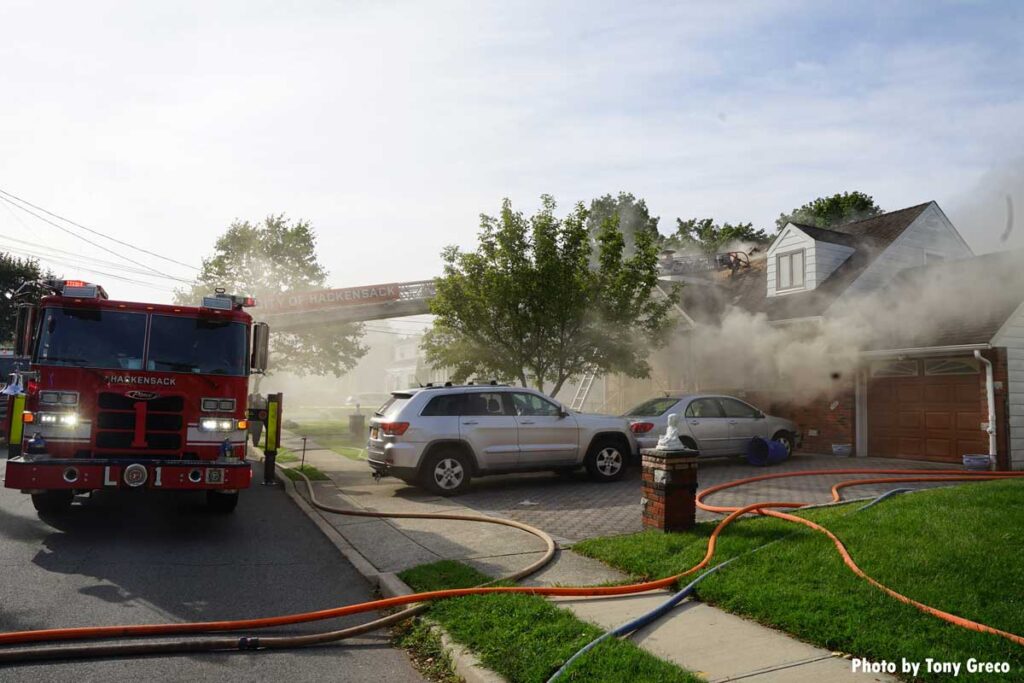 Hackensack fire apparatus aerial ladder at Rochelle Park New Jersey house fire