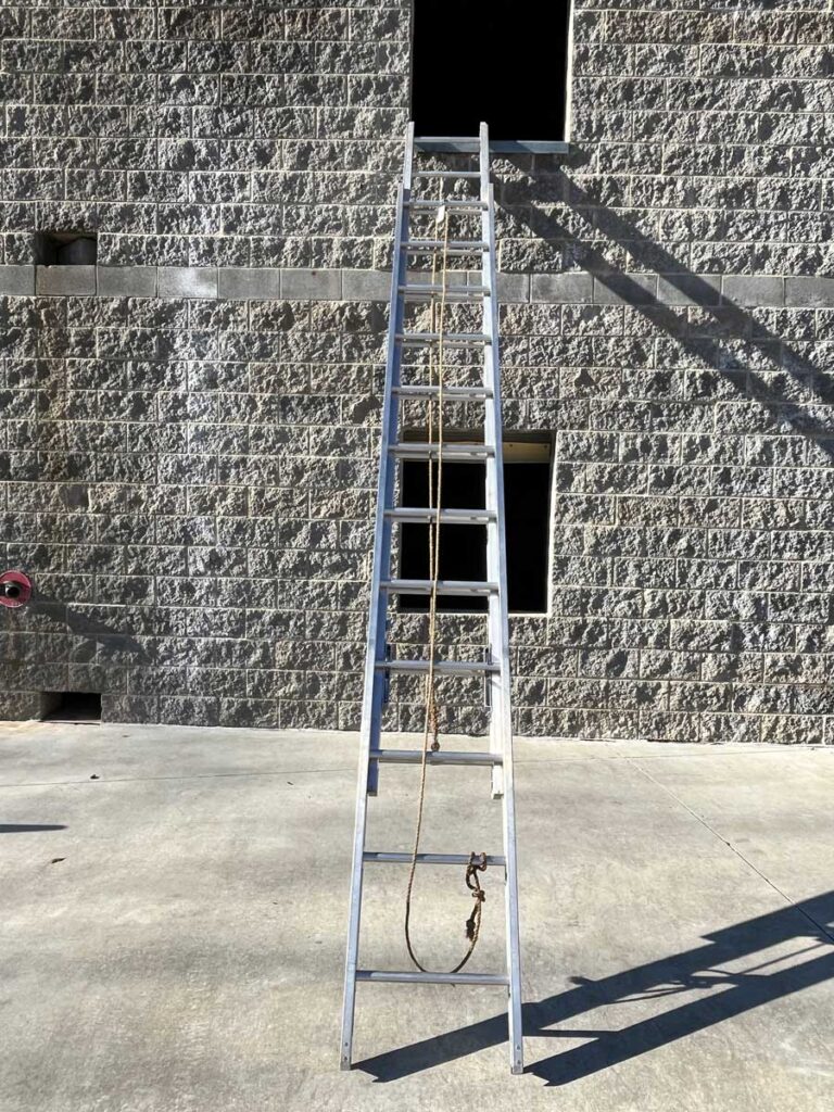 Ground ladder at side of window