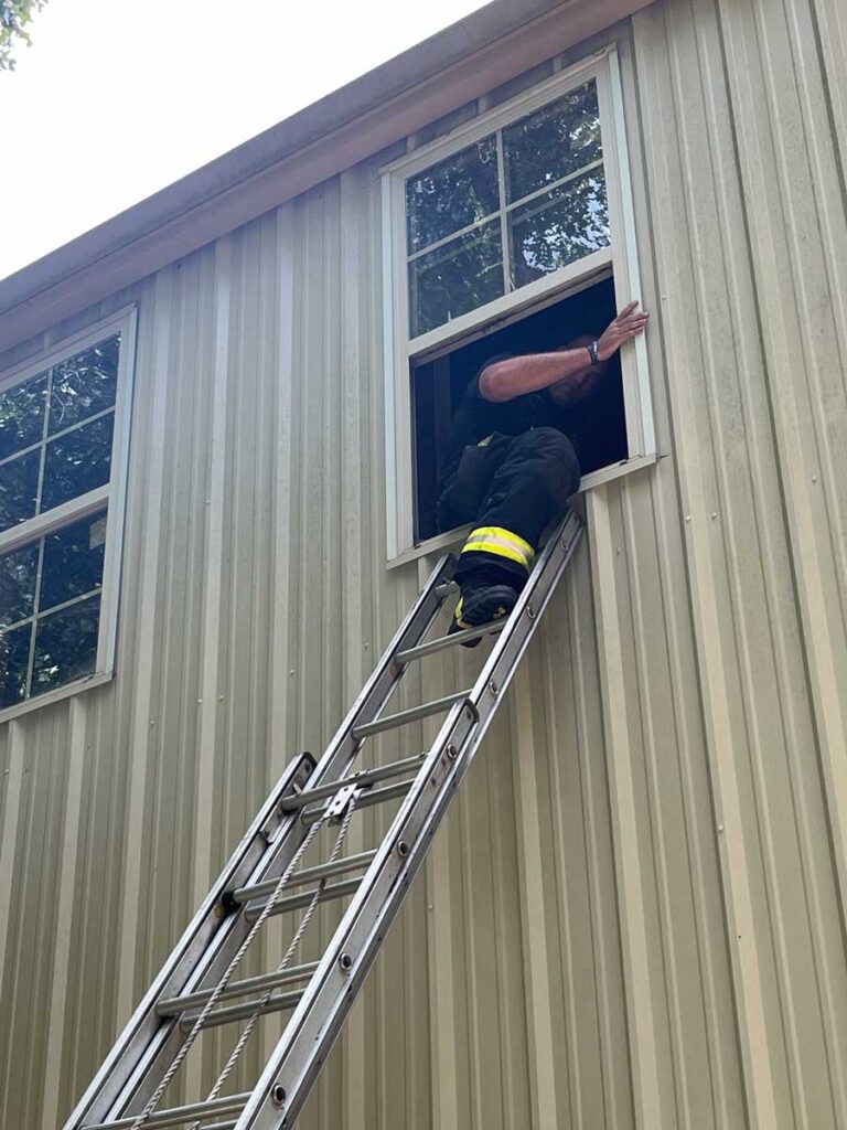 Placement of ladder at center of windowsill