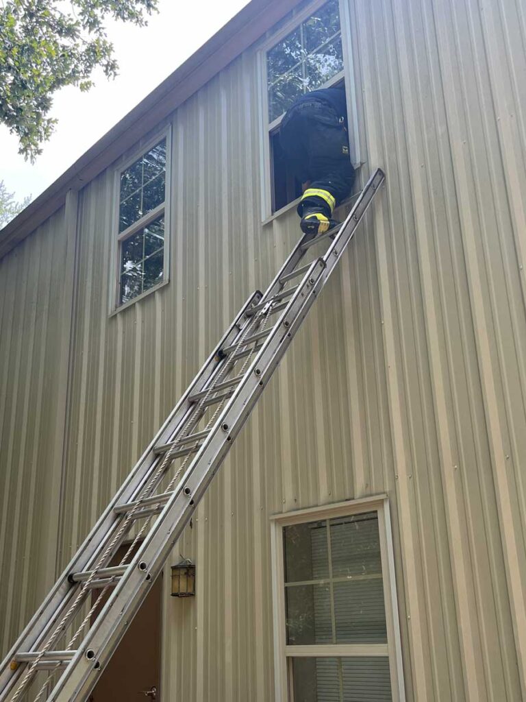 Placement of ladder at side of window