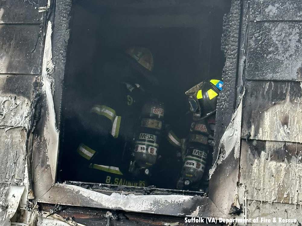 Firefighters seen through window