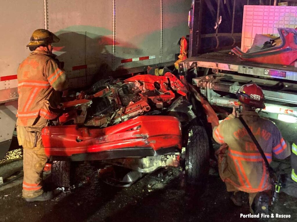 Portland firefighters at extrication pickup under tractor trailer