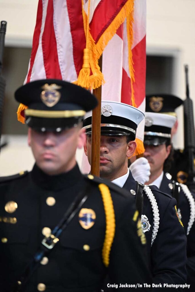 Orlando firefighters carrying flags