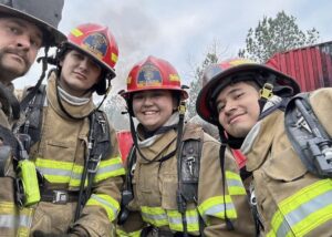 Mia Etheridge and other firefighters