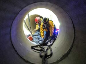 Firefighters in confined space rescue