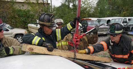 Firefighters use 4x4 and chain with lifting tool