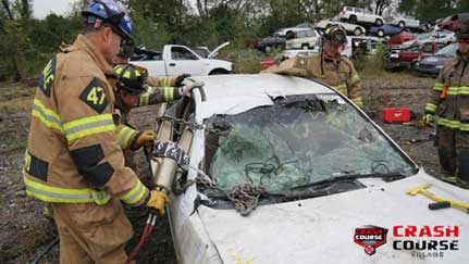 Firefighter uses spreader with chain