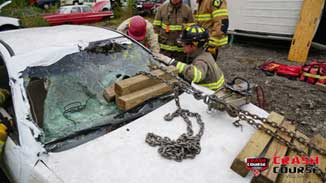 Chains and cribbing on car hood