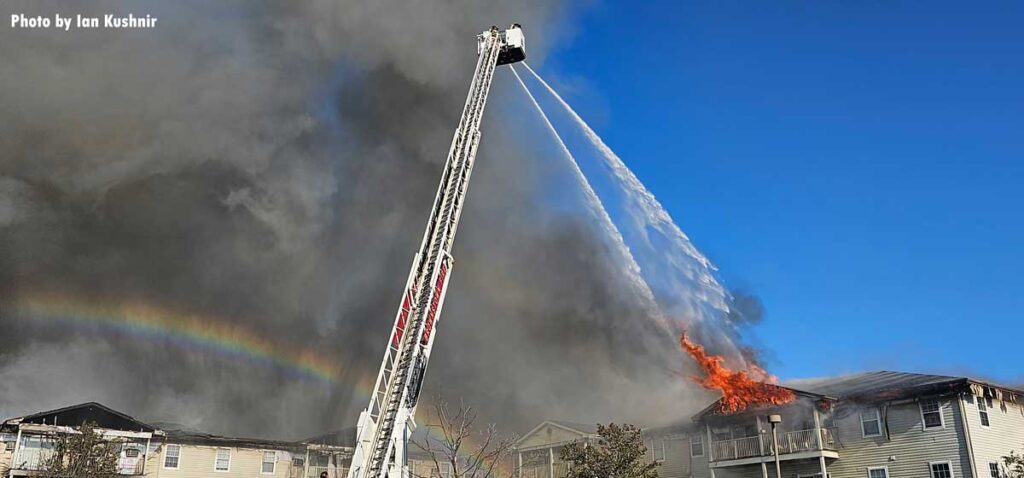 Tower ladder flowing water on Southgate fire